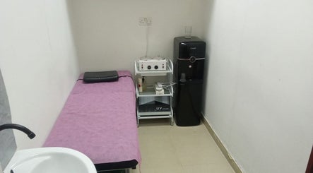 Treatment room at Sabeen Adnan Beauty Salon in Sharjah, Sharjah, AE, featuring bed and equipment.