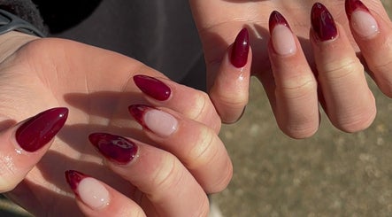 Elegant burgundy nail design at Anaya & CO., Saint James, Missouri, US.