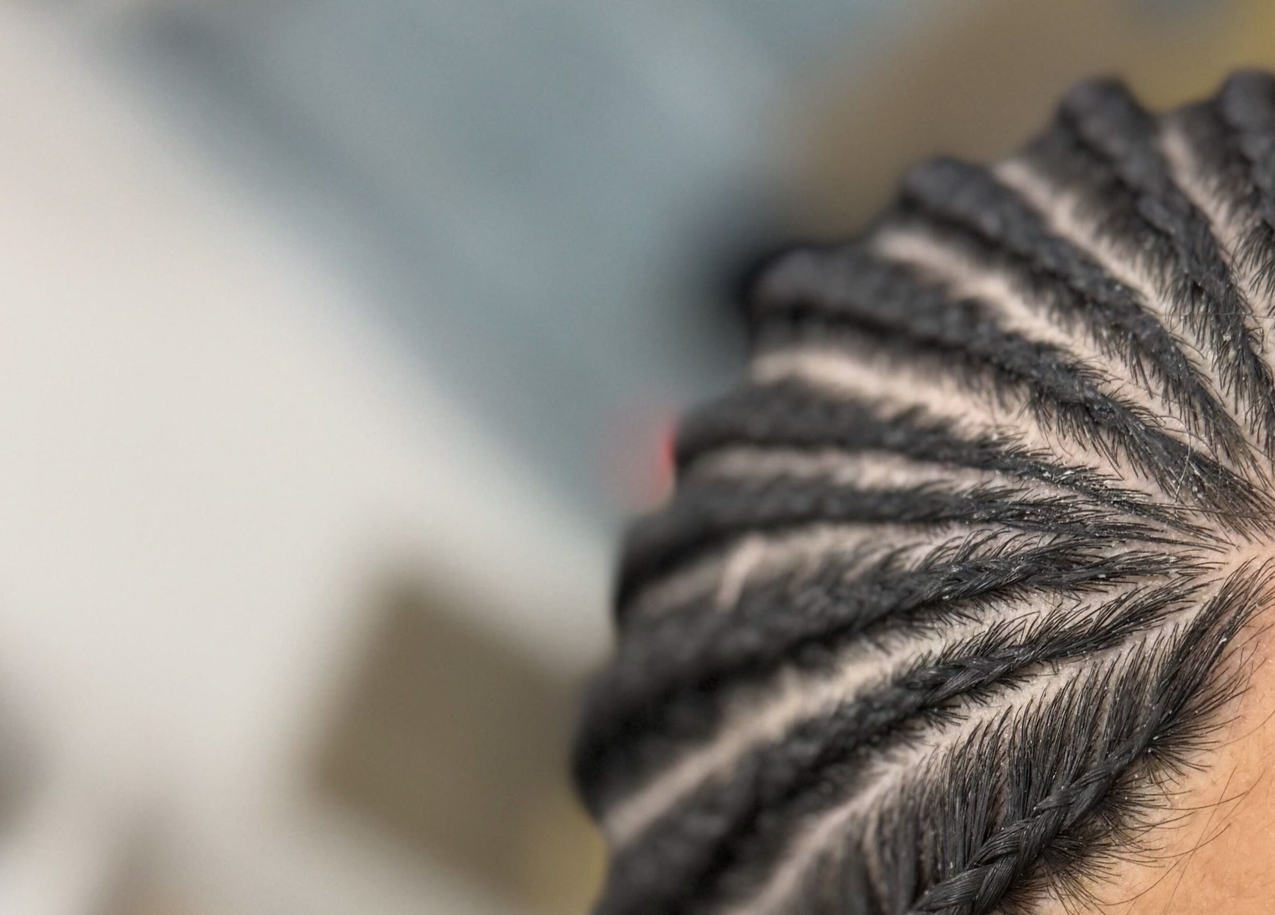 Close-up of intricate cornrow braids at Braidz By Annaa, Denham Court, New South Wales, AU.
