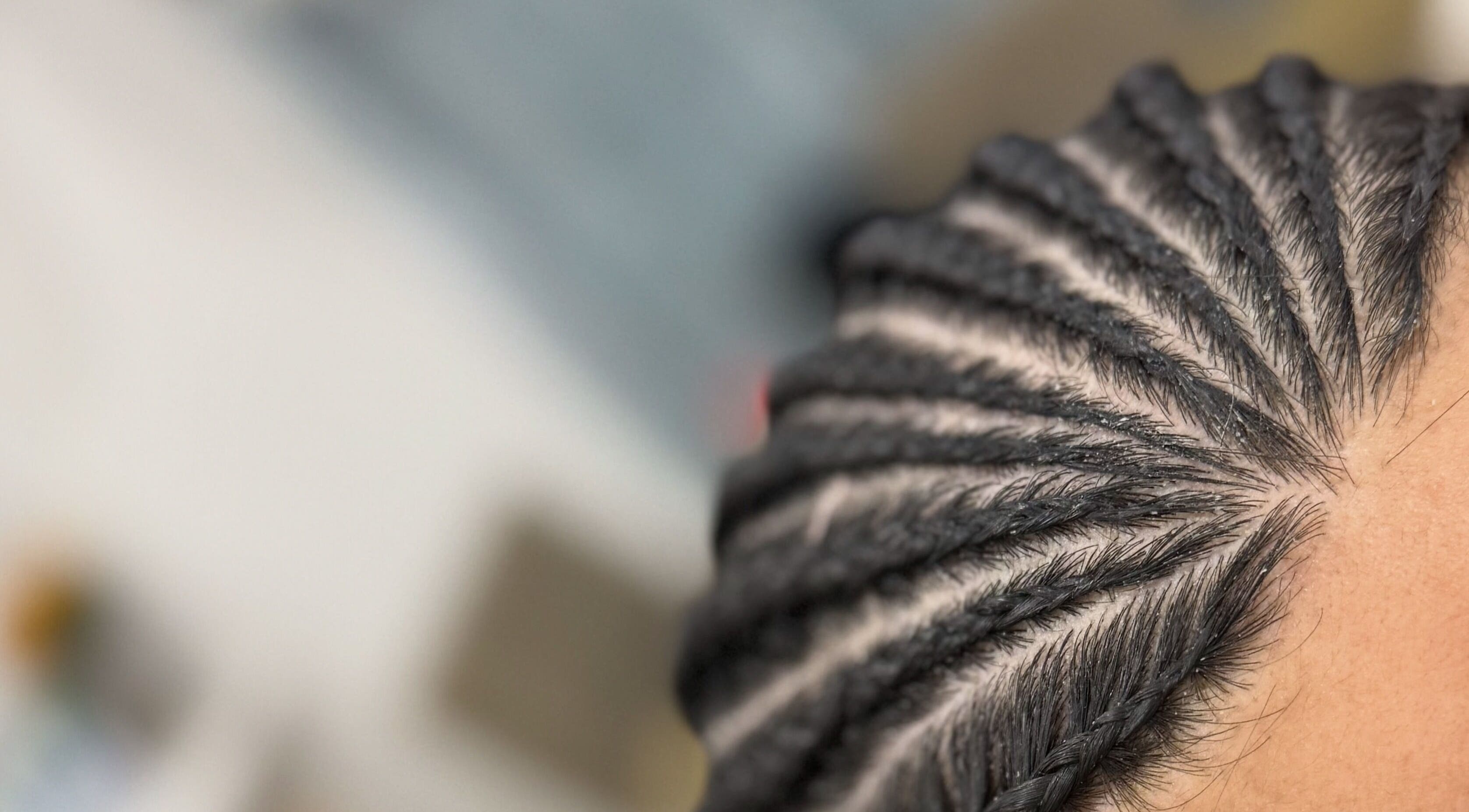 Close-up of intricate cornrow braids at Braidz By Annaa, Denham Court, New South Wales, AU.