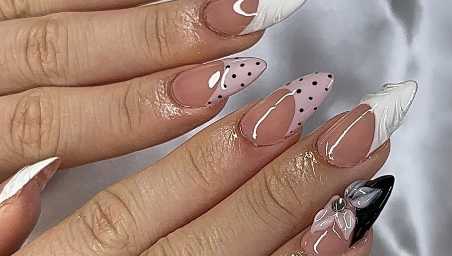 Stylish nail art featuring polka dots and florals at gelxbygaby in Marangaroo, Western Australia, AU.