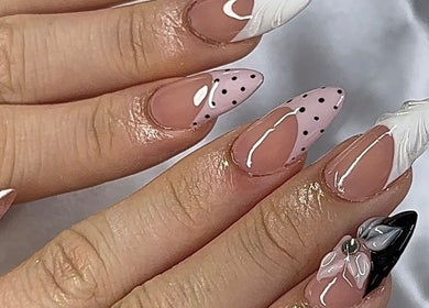 Stylish nail art featuring polka dots and florals at gelxbygaby in Marangaroo, Western Australia, AU.