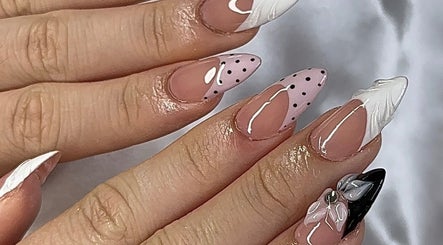 Stylish nail art featuring polka dots and florals at gelxbygaby in Marangaroo, Western Australia, AU.