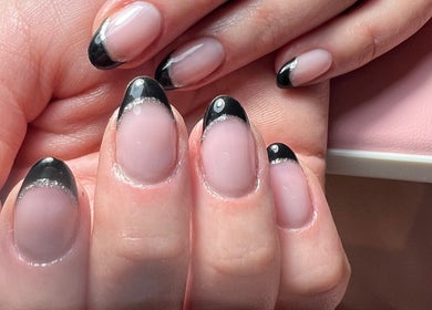 Elegant black French manicure at Aygol_nailbar, Brighton And Hove, England, GB. Stylish and sophisticated nail art.