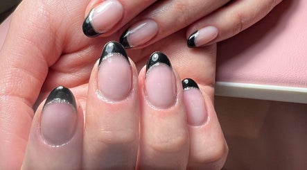 Elegant black French manicure at Aygol_nailbar, Brighton And Hove, England, GB. Stylish and sophisticated nail art.