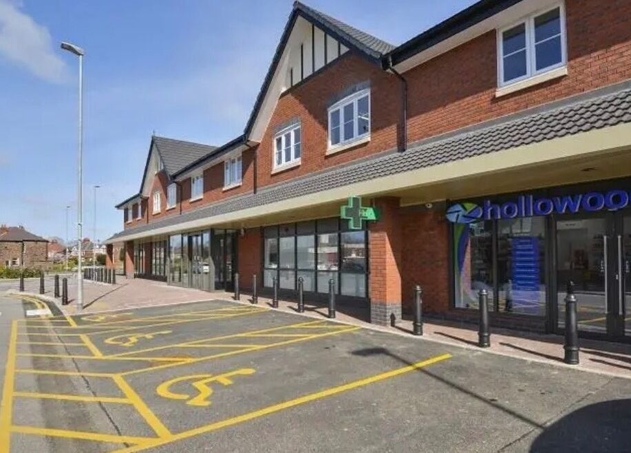 Exterior view of SW Massage at St Helens, England, GB, featuring modern brick facade and accessible parking.