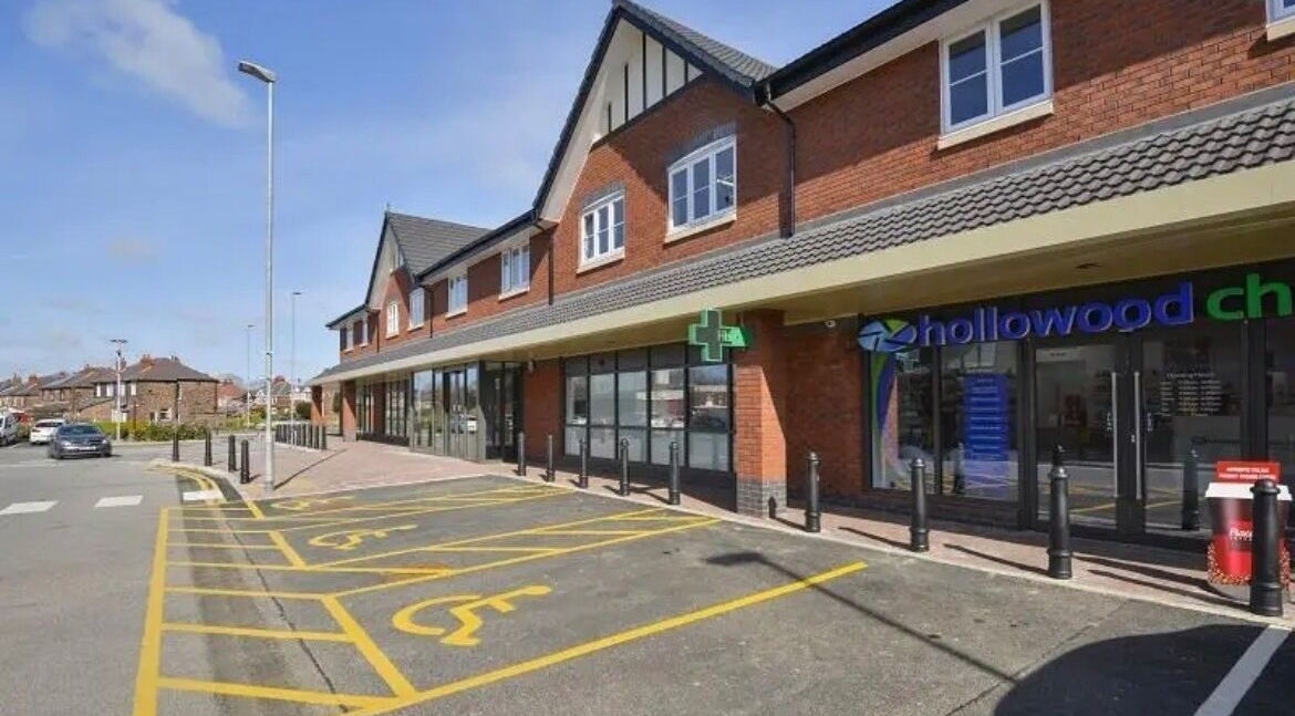 Exterior view of SW Massage at St Helens, England, GB, featuring modern brick facade and accessible parking.