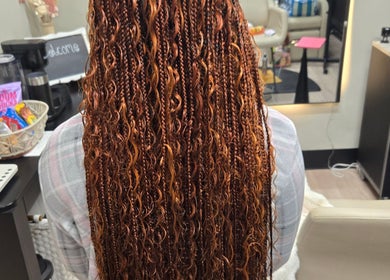 Long braided hairstyle at Sach Hair Braiding, Houston, TX. Intricate and stunning salon work.