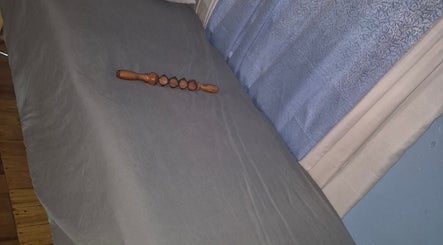 Massage table with wooden tool at REJUVENATE HEALTH SPA, Georgetown, Demerara-mahaica, GY.