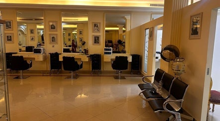 Modern salon interior at Ivari Beauty Centre, Ras Al-khaimah, Ras Al Khaimah, AE with stylish chairs and decor.