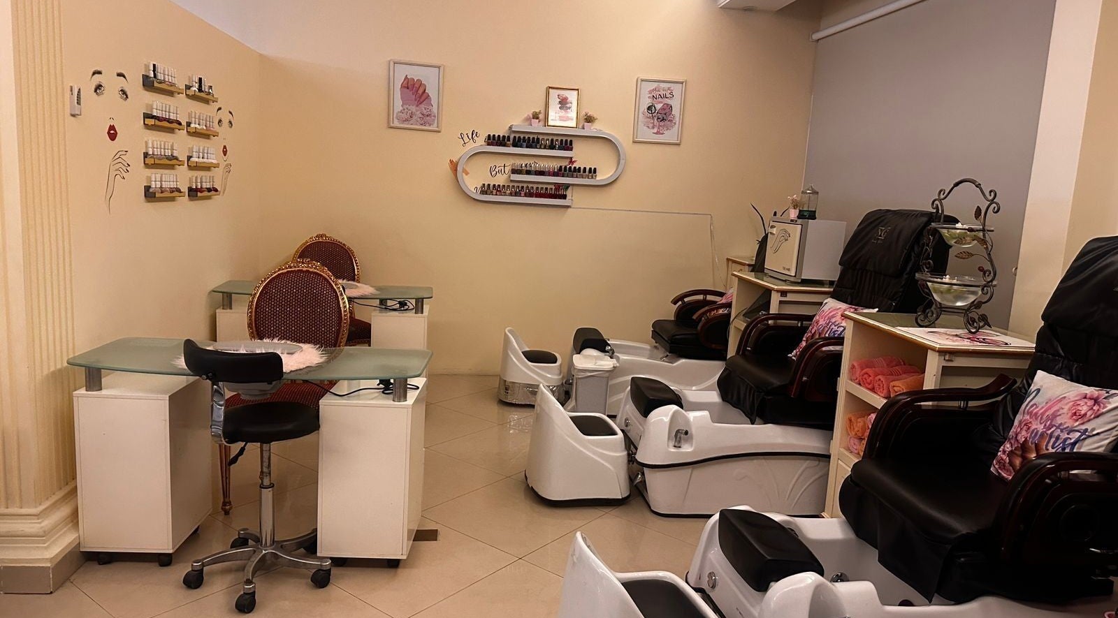 Cozy interior of Ivari Beauty Centre at Ras Al-khaimah, showcasing pedicure chairs and nail stations.