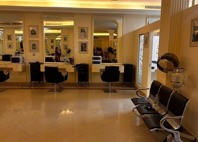 Interior of Ivari Beauty Centre, featuring modern salon chairs and mirrors, located in Ras Al-khaimah, Ras Al Khaimah, AE.