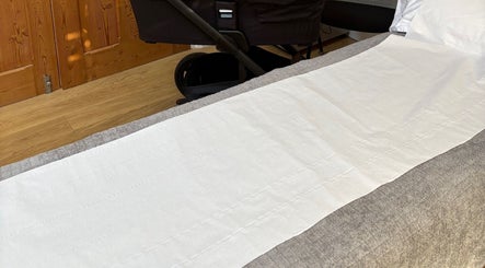 Cozy massage bed setup in Revive Massage and Scar Therapy, Newbold On Stour, England, GB, offering relaxation.