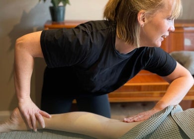Massage therapist at Revive Massage and Scar Therapy in Chipping Campden, England providing relaxing treatment.