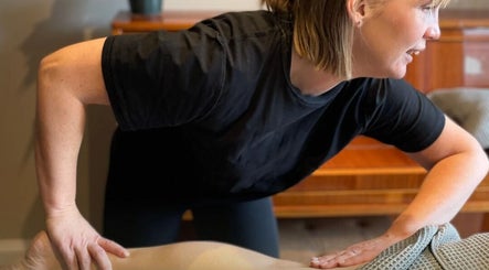 Massage therapist at Revive Massage and Scar Therapy in Chipping Campden, England providing relaxing treatment.