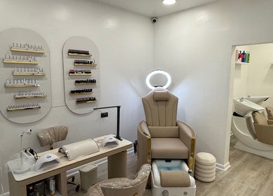 Luxury treatment area at Diva’s Beauty Studio, Hull, England, GB featuring elegant pedicure chair and nail polish display.