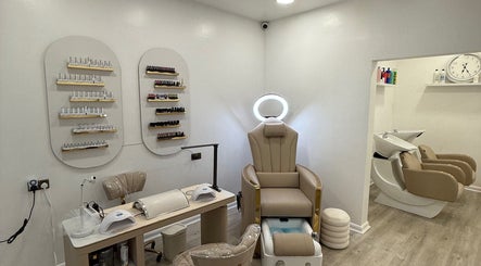 Luxury treatment area at Diva’s Beauty Studio, Hull, England, GB featuring elegant pedicure chair and nail polish display.