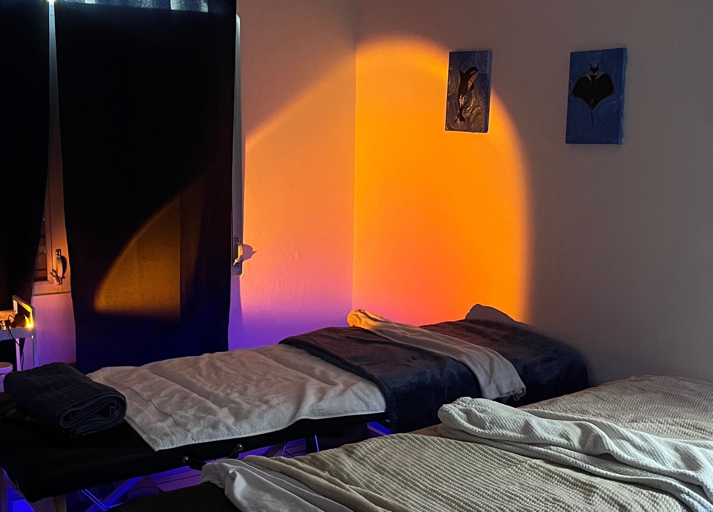 Massage room with tranquil lighting at Rilassante Aesthetics in Bayamón, Bayamón, PR. Relaxing ambiance.