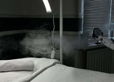Elysian Skin's tranquil therapy room with steam treatment setup in Birmingham, England, GB.