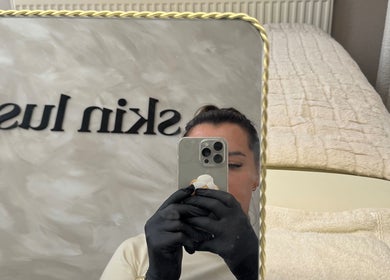 Reflection in a mirror at Skin Luse, Hazel Grove, England, GB, showcasing the relaxing treatment room.