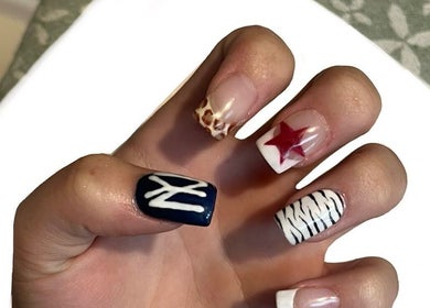 Vibrant nail art at Beauty By Imogen, Bridport, England, GB featuring diverse designs on manicured nails.