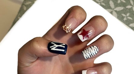 Vibrant nail art at Beauty By Imogen, Bridport, England, GB featuring diverse designs on manicured nails.