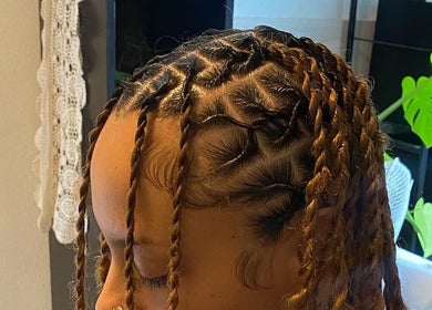 Stylish braided hairstyle created at Thee Glam Lab in Kingston, Ontario, CA, showcasing detailed artistry.
