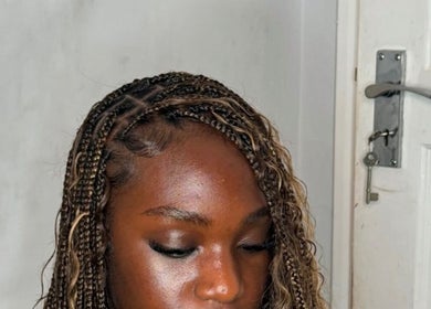 Intricately braided hairstyle at Thee Glam Lab, Kingston, Ontario, CA showcases expert hair artistry.
