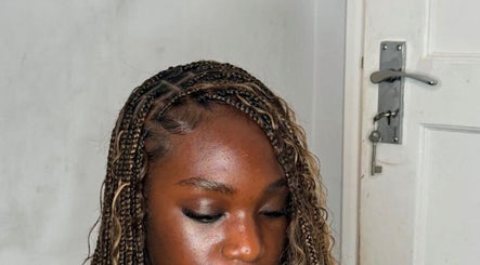 Intricately braided hairstyle at Thee Glam Lab, Kingston, Ontario, CA showcases expert hair artistry.