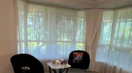 Relaxing seating area in Lumera Beauty, West Pennant Hills, New South Wales, AU with plush chairs and a table.