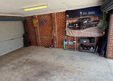 JD Automotive Detailing garage interior in Springdale Heights, New South Wales, AU with clean organized setup.