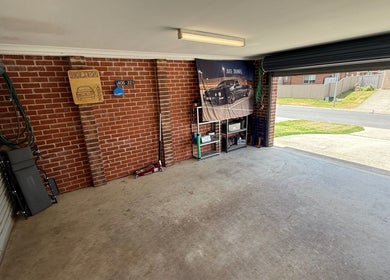 Spacious garage of JD Automotive Detailing at Springdale Heights, New South Wales, AU, showcasing organized tools.