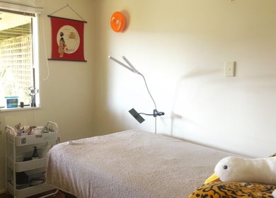 Relaxing treatment room at llashionista in Wellington, Wellington Region, NZ with a massage bed and serene decor.