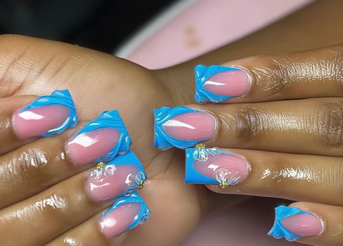 Close-up of stylish blue and pink nail art at Nail’d it by Joanna, May Pen, Clarendon, JM.