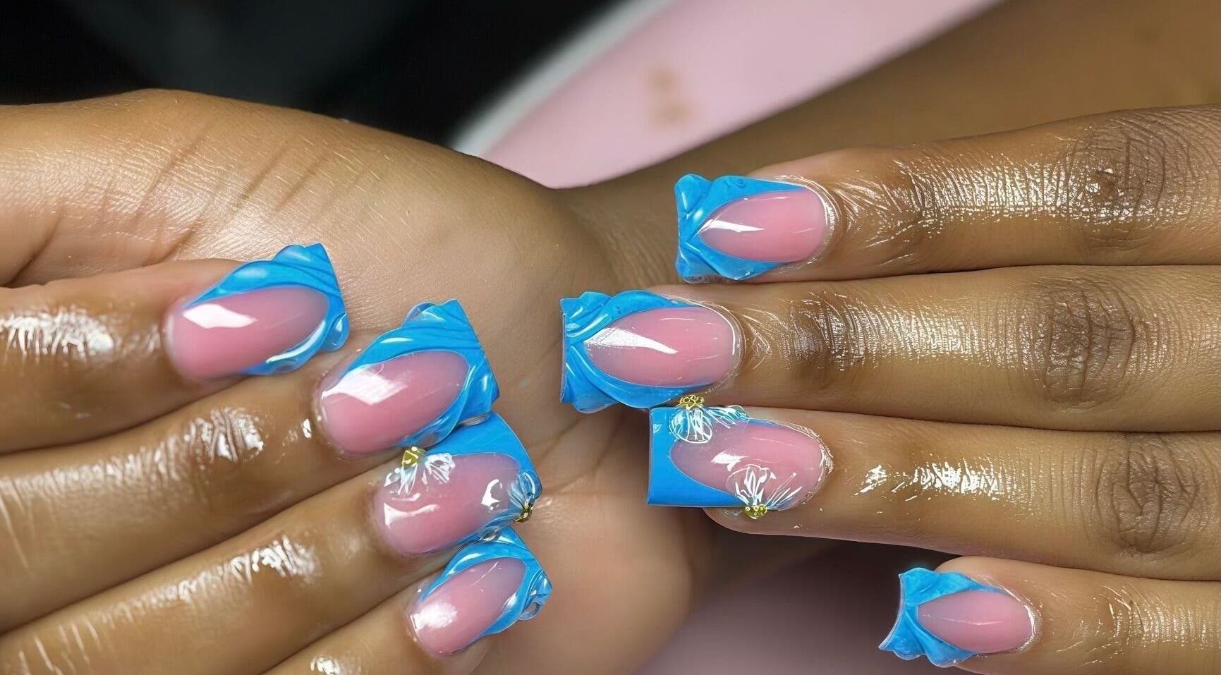 Close-up of stylish blue and pink nail art at Nail’d it by Joanna, May Pen, Clarendon, JM.