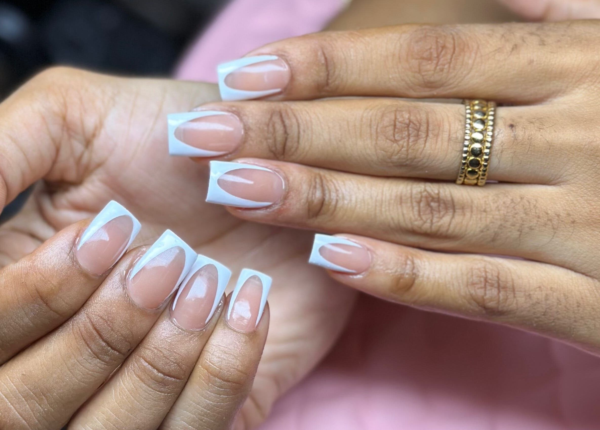 Elegant French manicure with a unique twist at Nail’d it by Joanna, May Pen, Clarendon, JM.