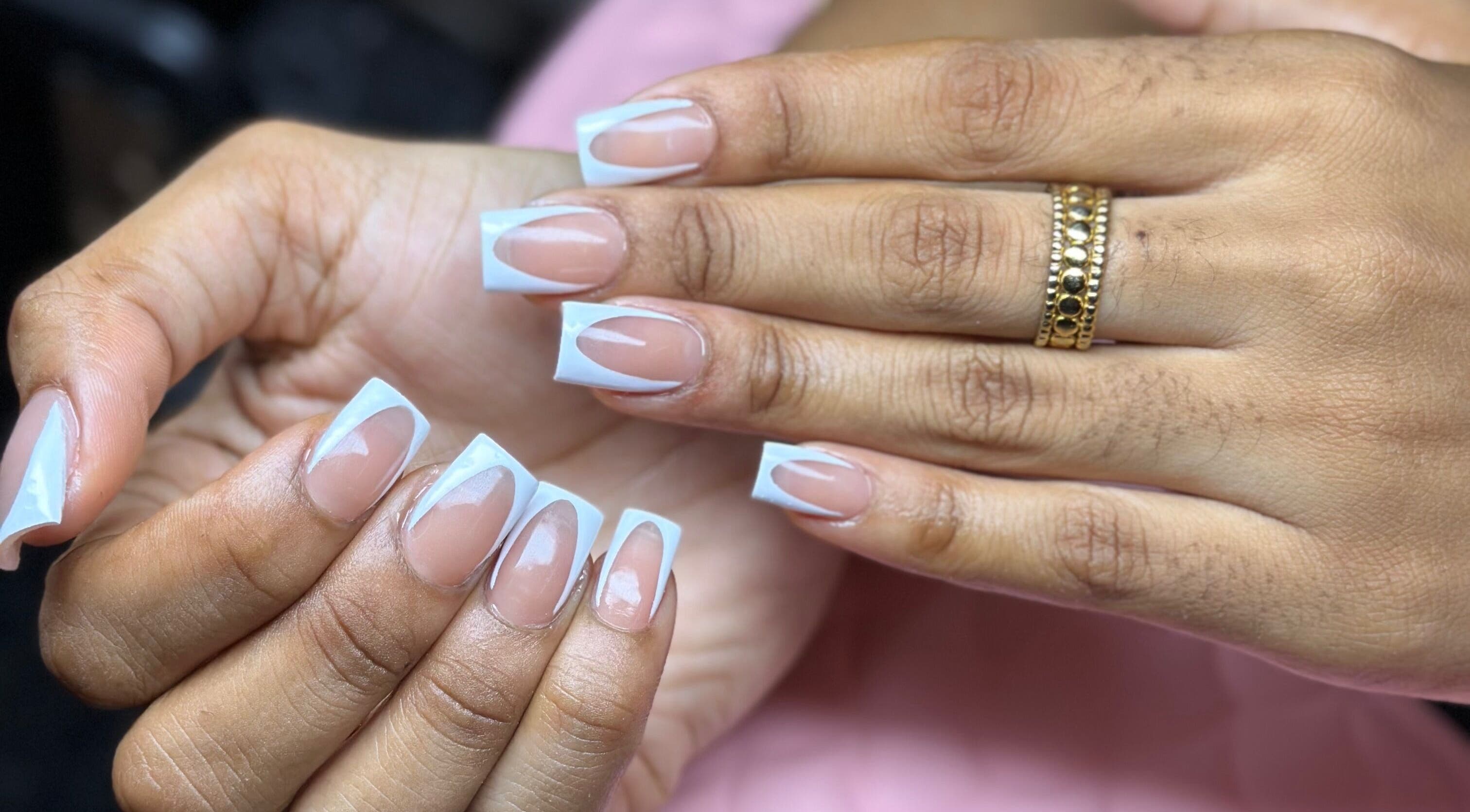 Elegant French manicure with a unique twist at Nail’d it by Joanna, May Pen, Clarendon, JM.