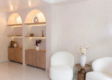 Elegant seating and decor at Sculpt Lab in Bedfordview, Gauteng, ZA, showcasing modern wellness ambiance.