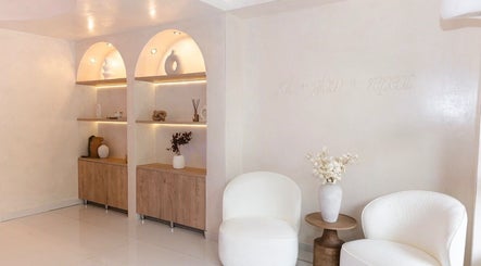 Elegant seating and decor at Sculpt Lab in Bedfordview, Gauteng, ZA, showcasing modern wellness ambiance.
