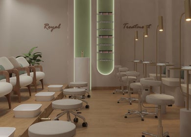Elegant nail area at Elixira Ladies Beauty Lounge, Abu Dhabi, AE with plush seating and ambient lighting.