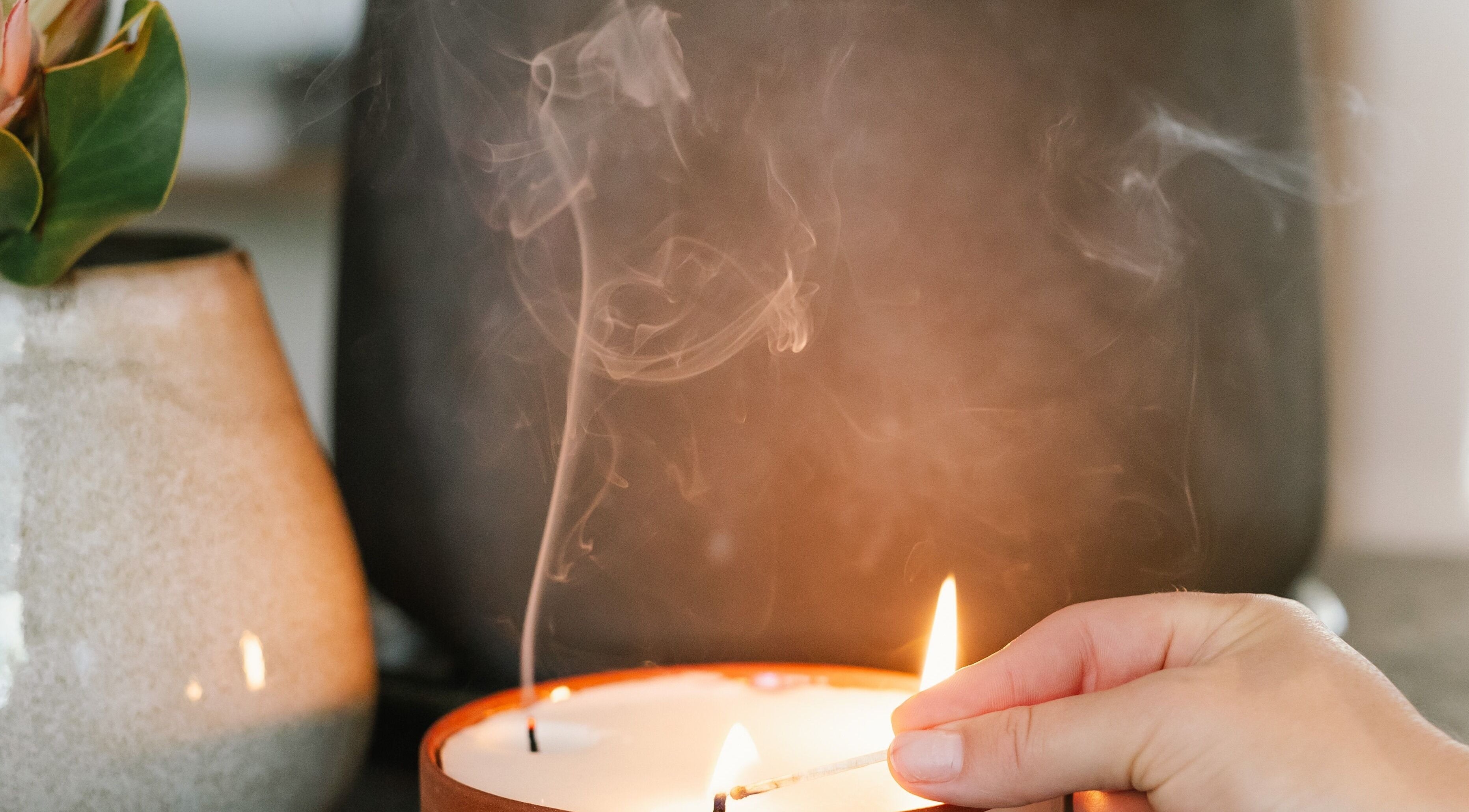 Lit candle with floral decor at Stellenbosch Wellness Salon, Stellenbosch, Western Cape, ZA.