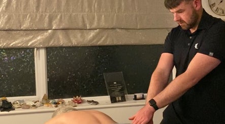 Massage therapy session at JJS Massage, Warwickshire, England, GB. A therapist is providing a relaxing massage.