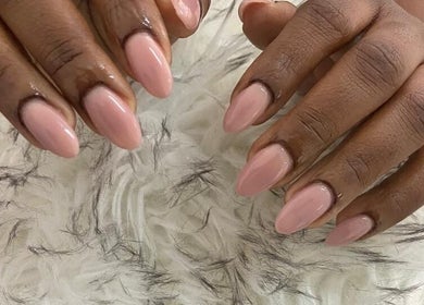 Close-up of elegant pink manicure at Gifted Handz, Pretoria, Gauteng, ZA on a luxurious white fur background.