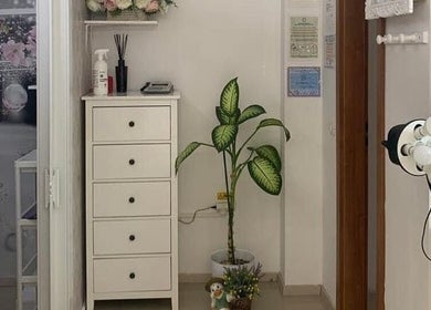 Cozy corner at Look At Me Beauty Salon in Giroc, Județul Timiș, RO, featuring a plant and elegant decor.