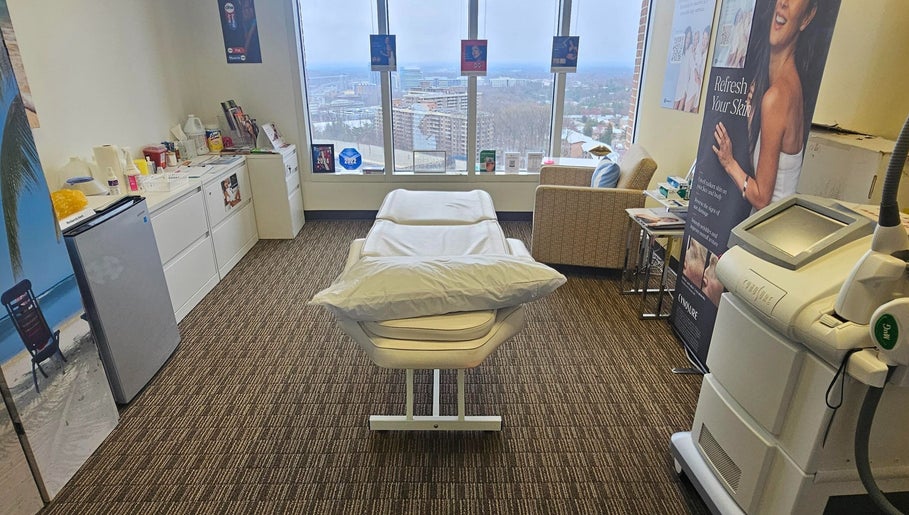 Serene treatment room at Body Sculpt Skin Laser in Vienna, Virginia, US, with a view of the cityscape.