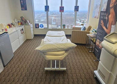 Serene treatment room at Body Sculpt Skin Laser in Vienna, Virginia, US, with a view of the cityscape.