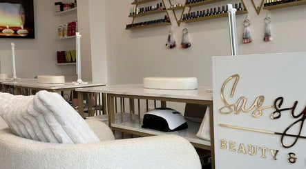 Elegant nail salon interior at Sassy P Beauty & Co - Hale, Altrincham, England, GB with cozy white seating.