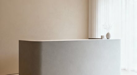 Minimalist reception at Massage with a Twist, Marrickville, New South Wales, AU with vase decoration.