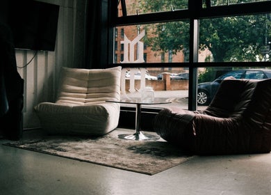 Cozy seating area with chairs and a table at DTRHair, Newcastle upon Tyne, England, GB.