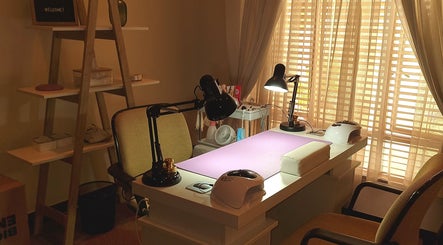 Tranquil nail desk setup at Nails by Tazmé, Roodepoort, Gauteng, ZA with soft lighting and stylish decor.